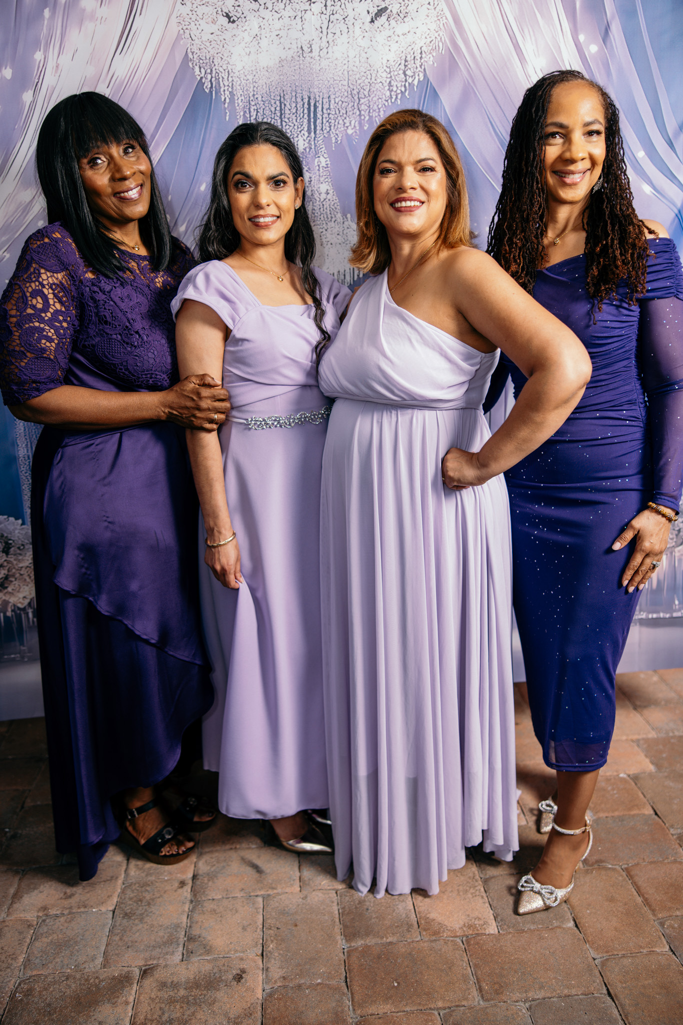 Women of Kingdom Queens Rising gathered around a table with open Bibles